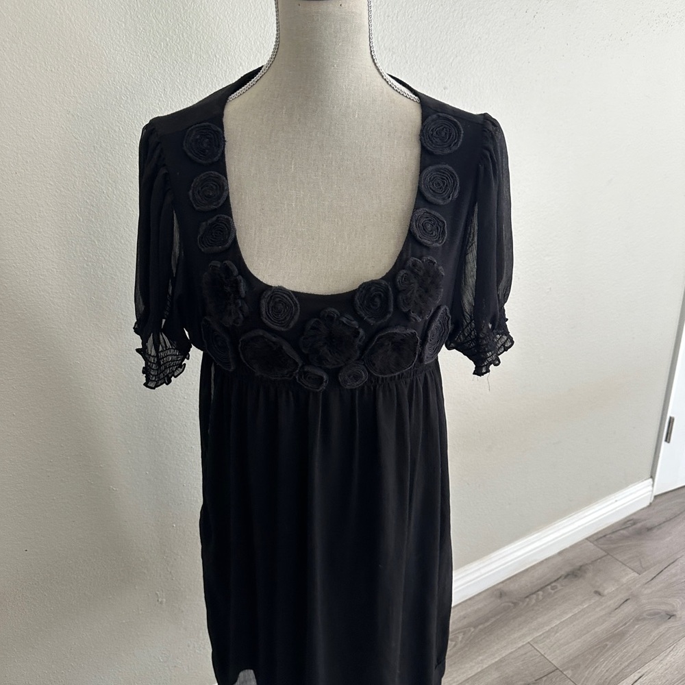 ECI Black Garment with Cream Label